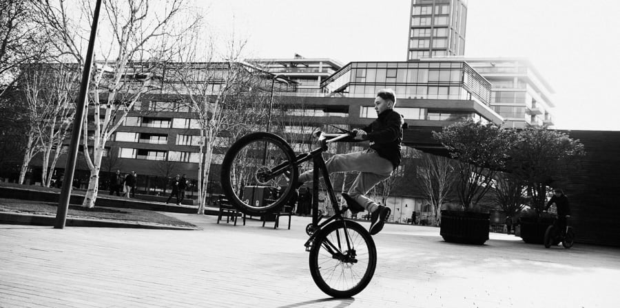 Kid doing bike tricks