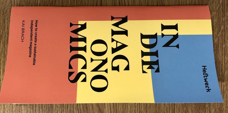 The cover of Indie Magonomics, which features salmon, yellow and blue-coloured boxes laid over each other.