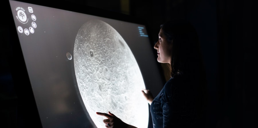 Woman playing with digital screen