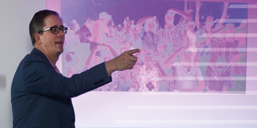 Lecturer in front of projector screen