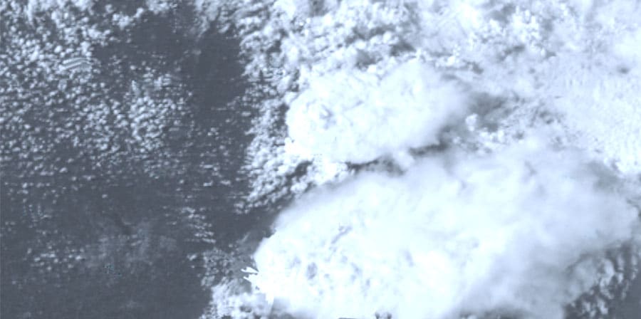 Abstract digital image, resembles grey clouds or smoke over a dark background