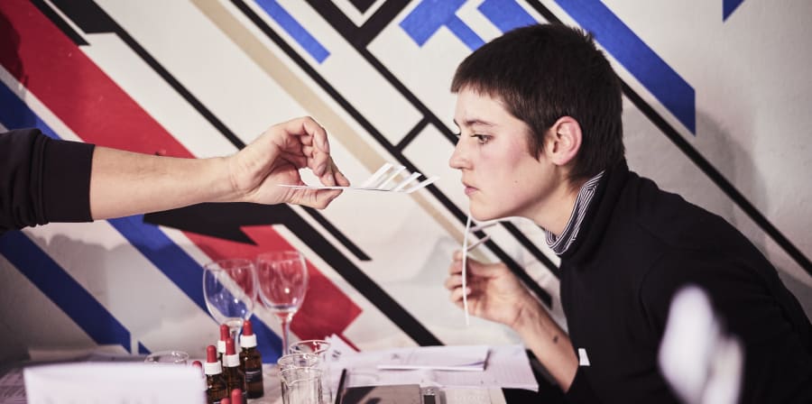 Woman smelling perfume
