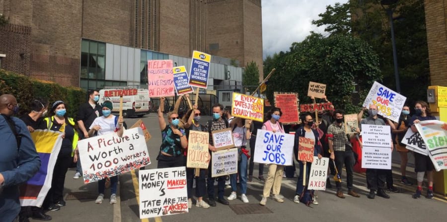 people picketting at an outdoor demonstration