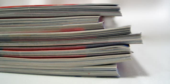Side view of a pile of magazines