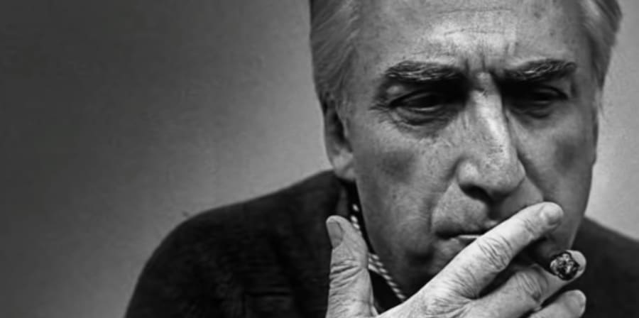 A black and white portrait of Roland Barthes