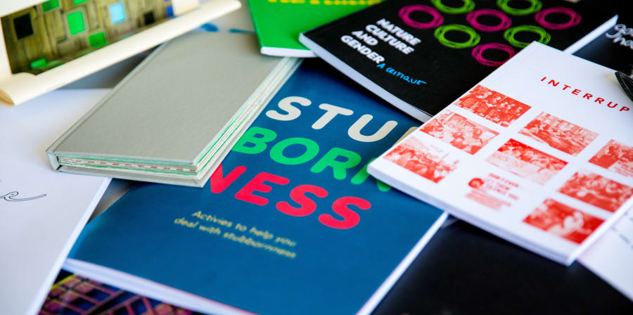 Examples of student Graphic Design work in the form of colourful booklets.