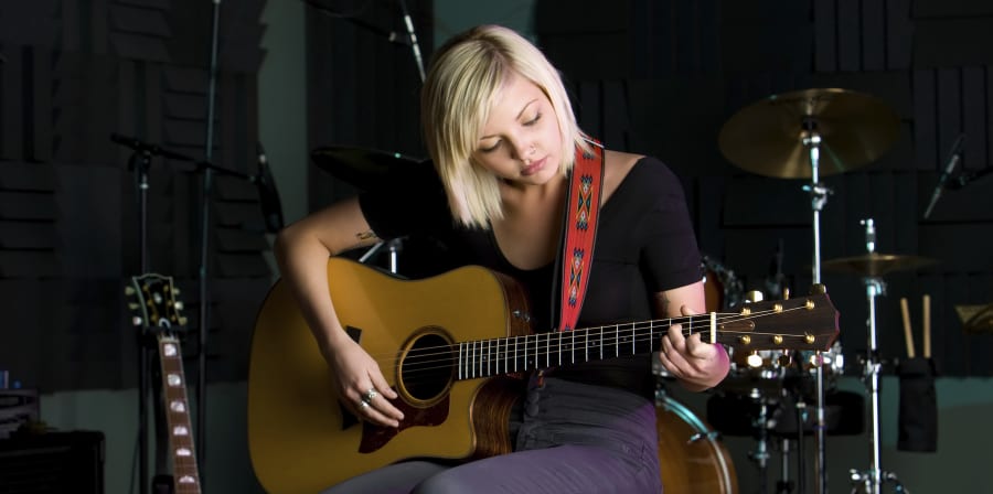 Woman playing guitar