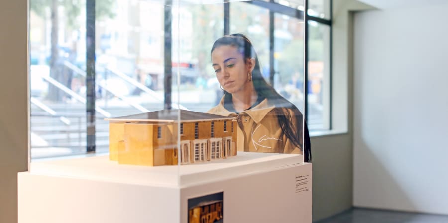 Girl examining an exhibit at a summer show