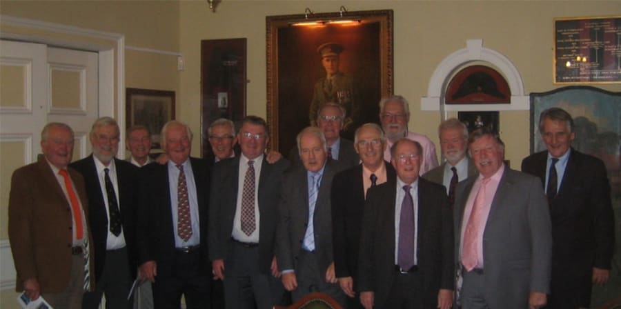 The group celebrates in the Queen Victoria Rifles' London Mess.