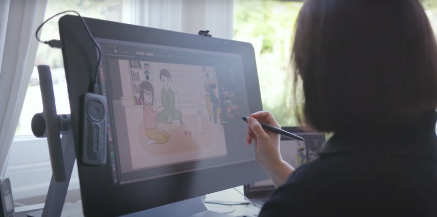 Person drawing with digital pen on computer screen