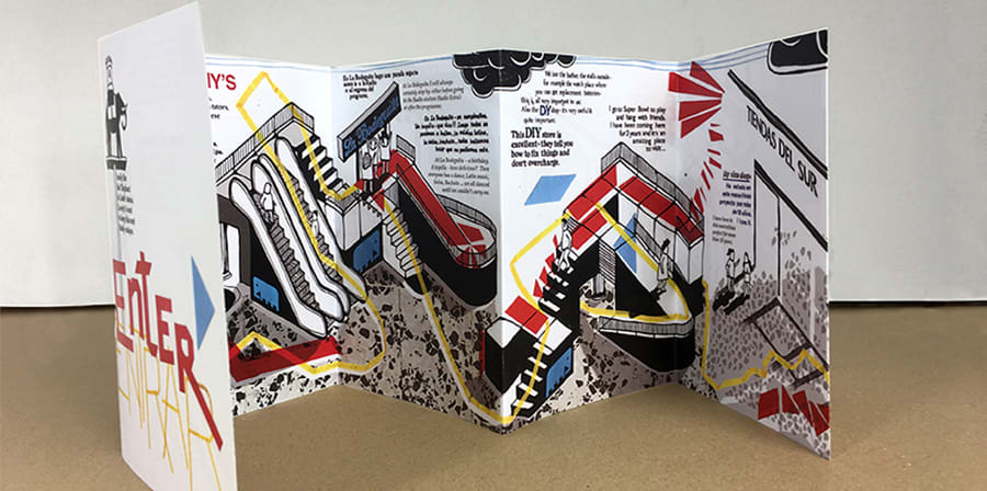 Photograph of an illustrated pamphlet standing up