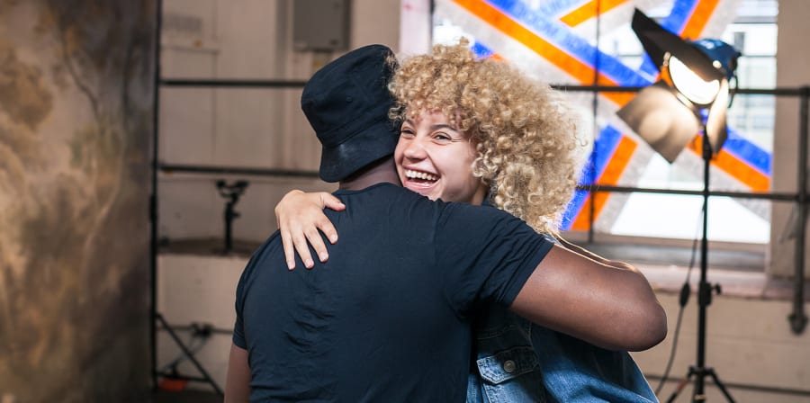 Students hugging on a photo shoot