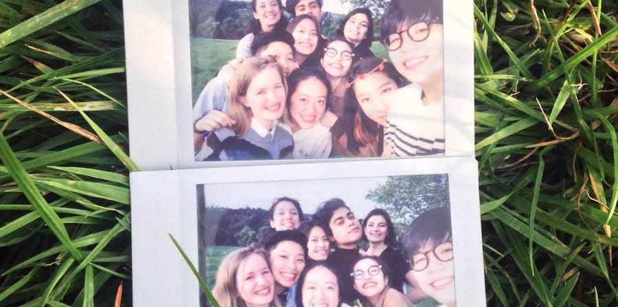 Polaroid of a smiling group of students