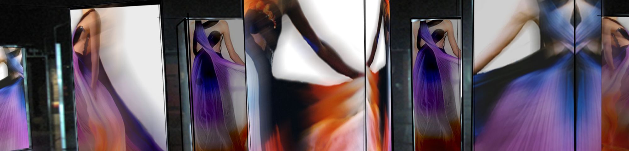 Images of purple and red gowns projected onto screens