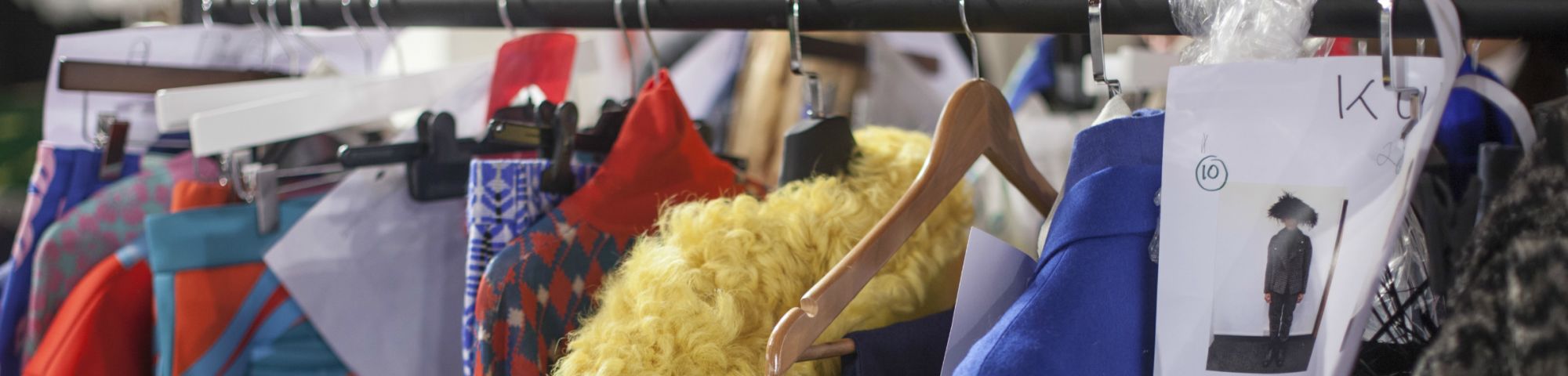 Items of clothing hanging on a rail