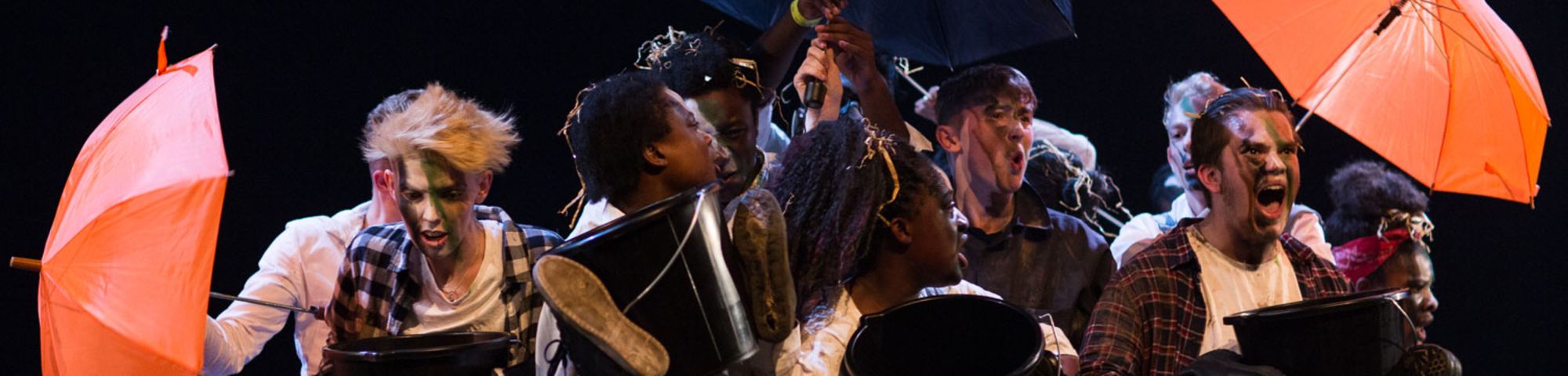 A group of students performing on stage at UAL Awarding Body's Emerge festival.