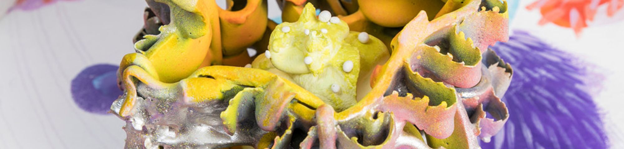 Close up shot of a piece of a colourful sculpture