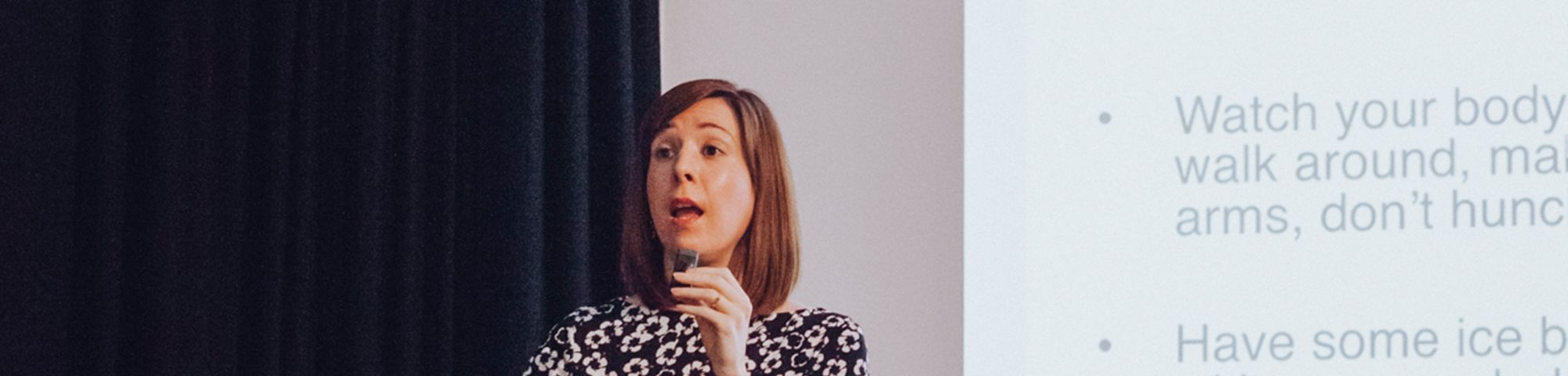 Woman talking at a presentation