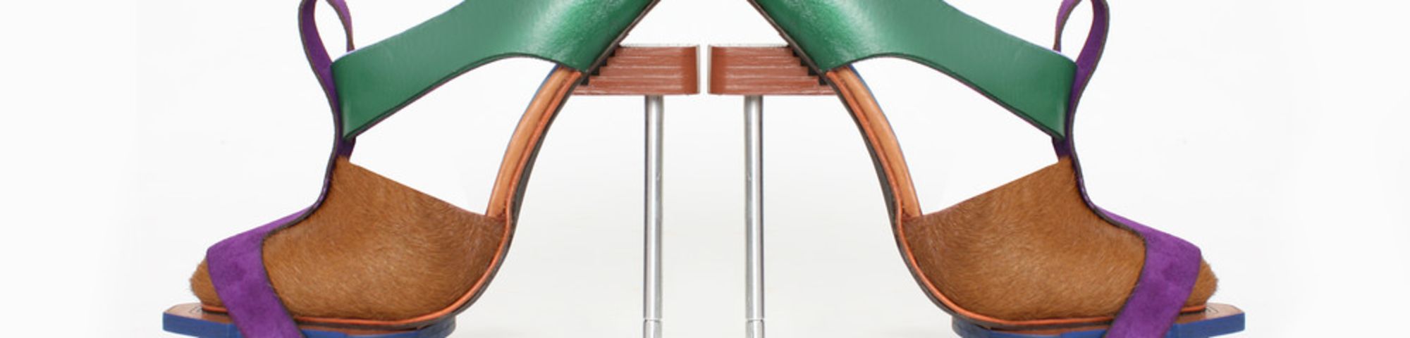 A pair of green, blue and brown shoes produced by a student at London College of Fashion