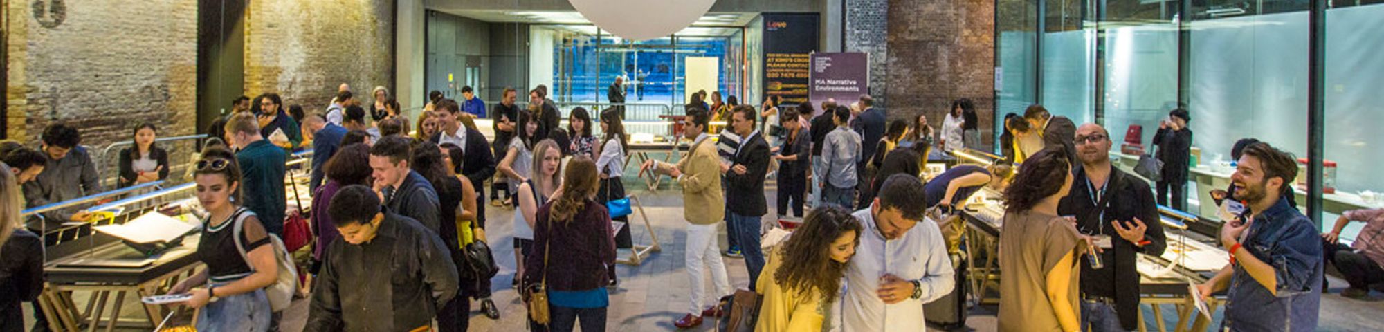 A group of people at an exhibition of at work at Central Saint Martins