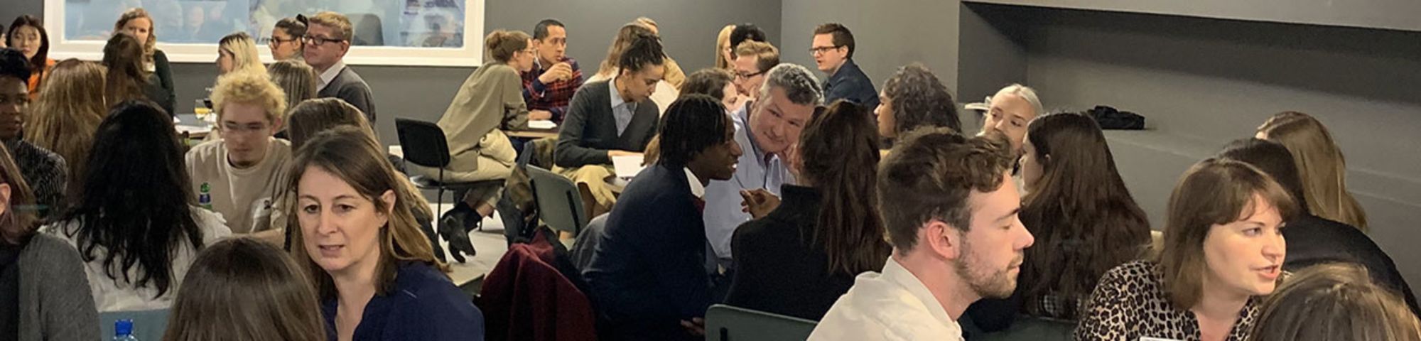 Students and guests chat over tables in LCC's Typo Cafe.