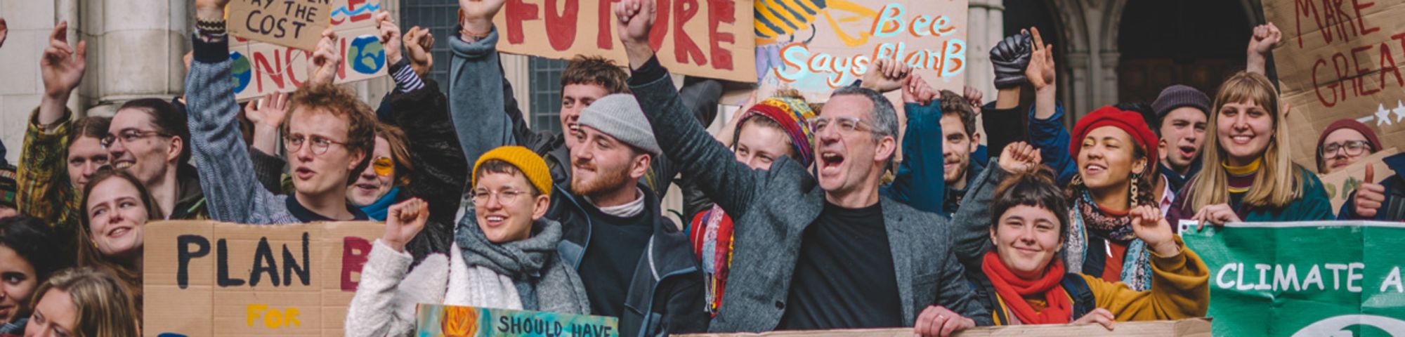 Photo of group of climate protestors holding banners, including 'We demand a future'