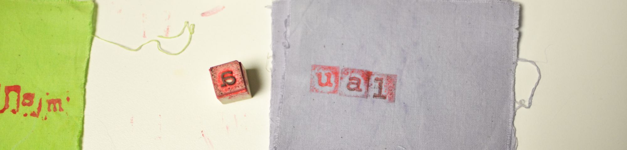 letter blocks and fabric bage with UAL spelled out