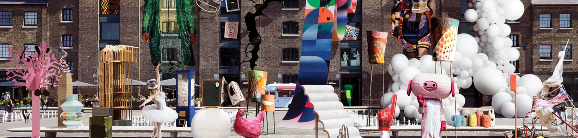 Photo of CSM Granary Building facade with student work collaged onto it