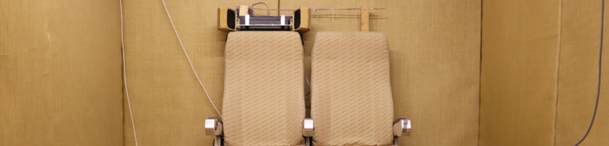 Room with chairs connected to speakers