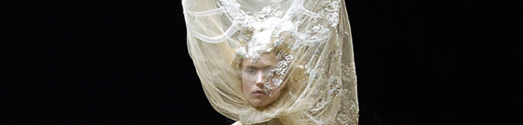 Tulle and lace dress with veil and antlers, Alexander McQueen Widows of Culloden, A/W 2006–07. Raquel Zimmerman, VIVA London, Image: firstVIEW