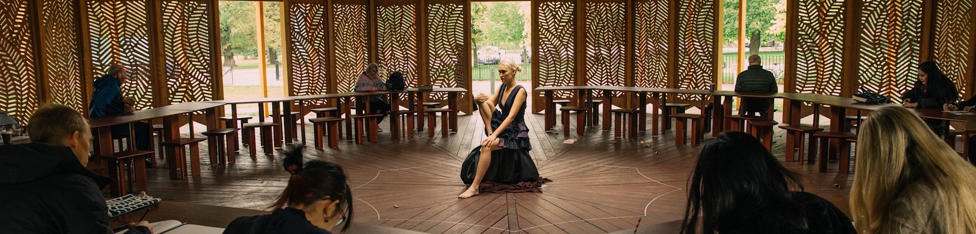 Student drawing a live model 