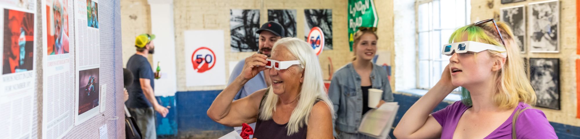 People engaging with artwork at Origins Creative Arts Festival 2019