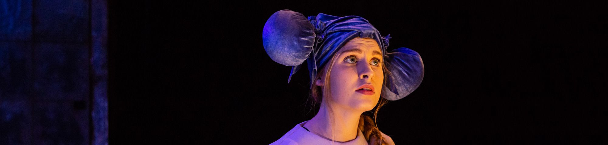 Acting performance on stage, girl with worried facial expression