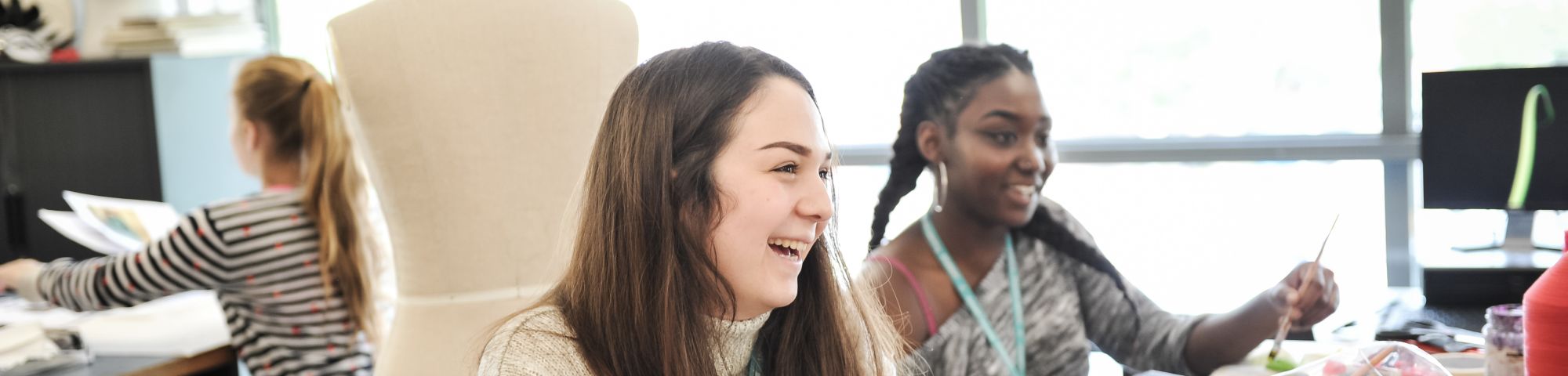 Girls in art studio laughing