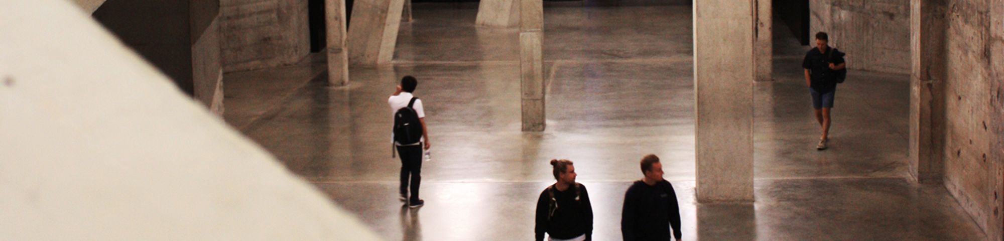 the interiors of the tate modern you can see two people walking