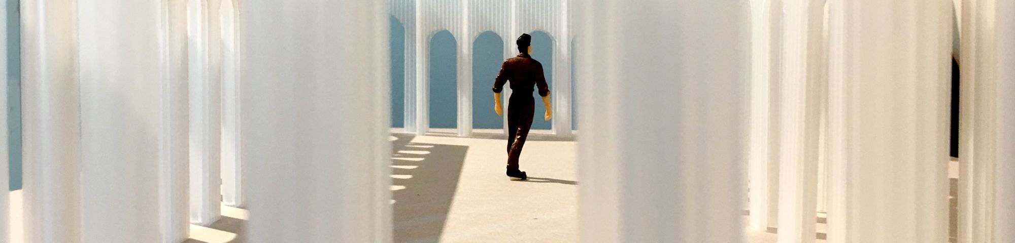 Conceptual image depicting man within translucent arches