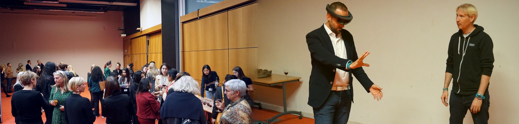 Image of people networking and with matthew drinkwater using virtual reality