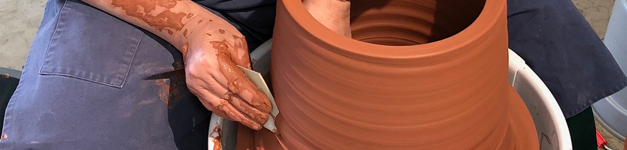 A man in the process of pottery