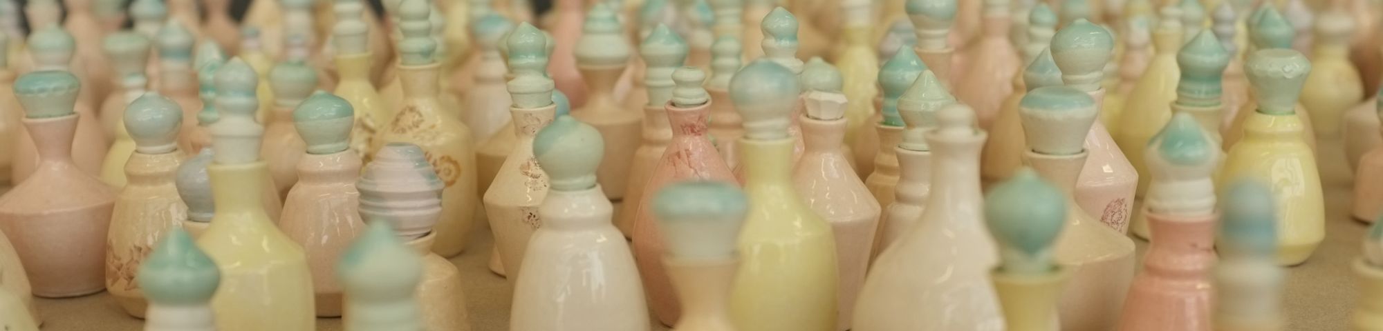 Small multicoloured ceramic pieces arranged on a floor