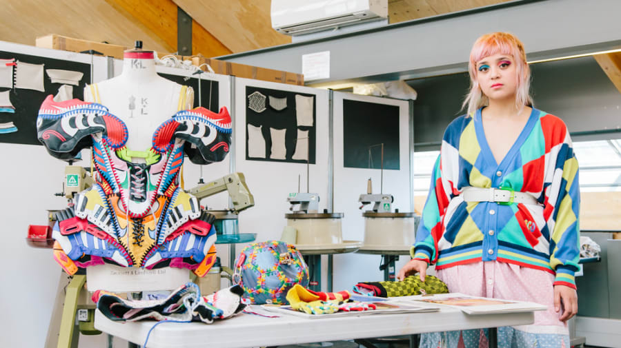 CSM graduate Paolina Russo pictured in a studio with her multicoloured design pieces