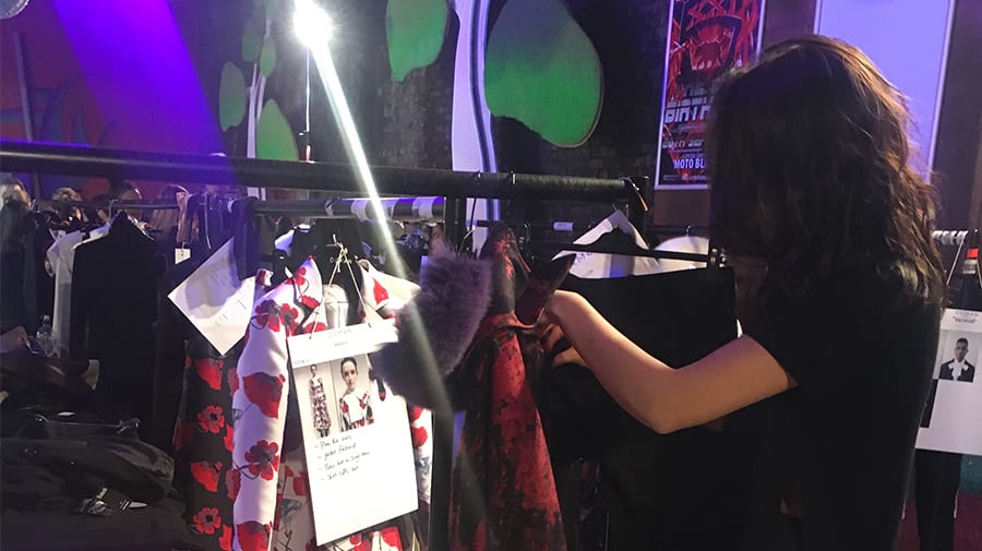 Andrea volunteering as a dresser backstage at Osman London fashion show