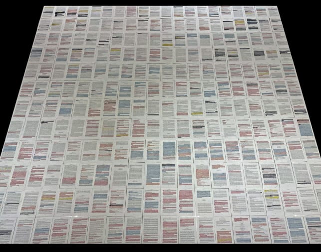 papers with hand highlighted text