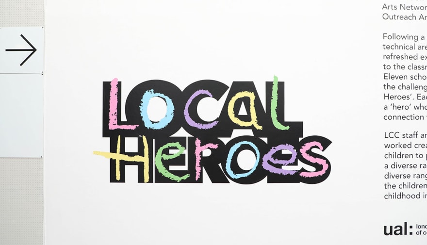 Image depicts a wall exhibit which reads 'Local Heroes' in a large, colourful font.