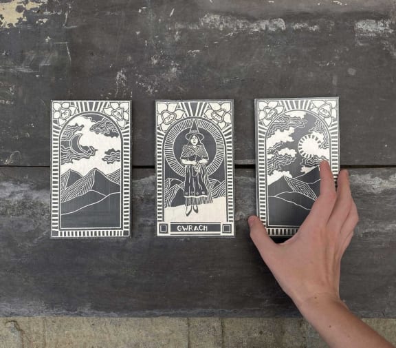 Three illustrated ceramic figures