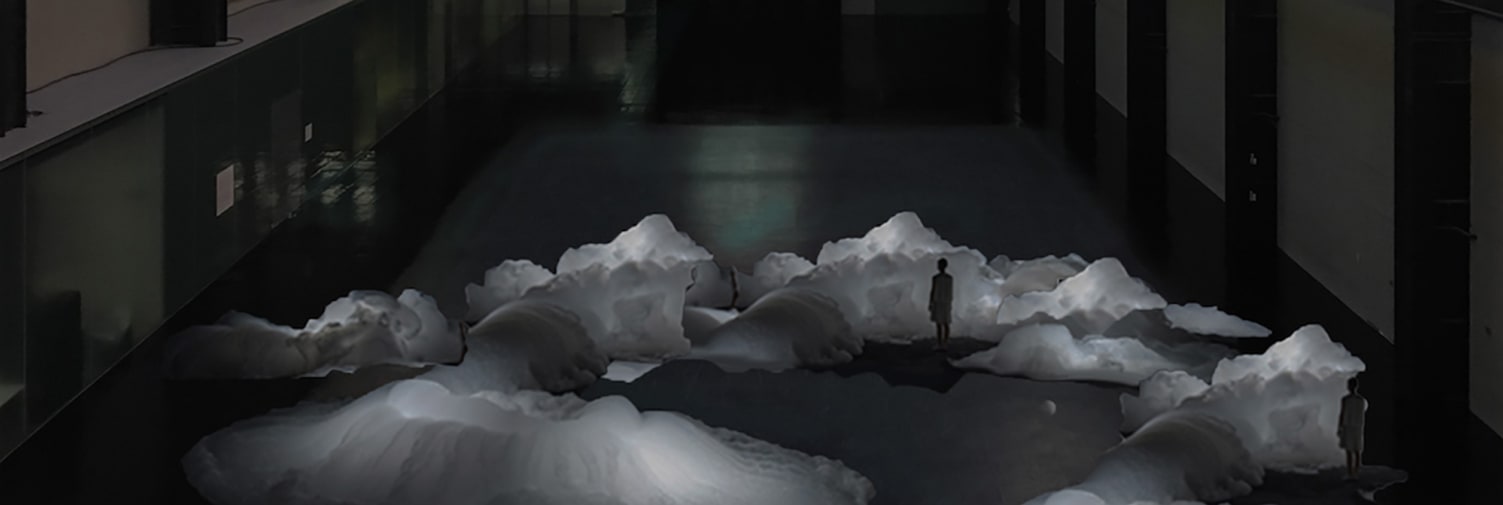 Twilight setting with silhouette of person standing in the midst of mountains