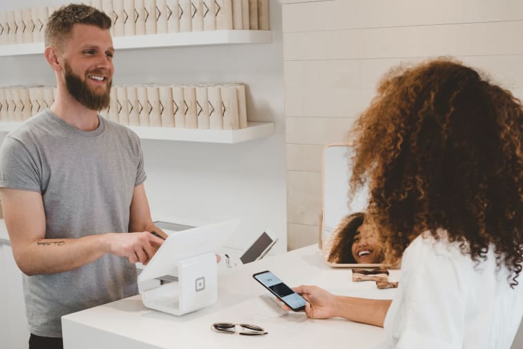 A man using selling products to a woman
