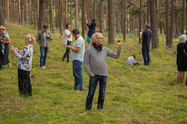Participatory performance in forest by Paul Cegys. Photo by Andrej Vasilenko