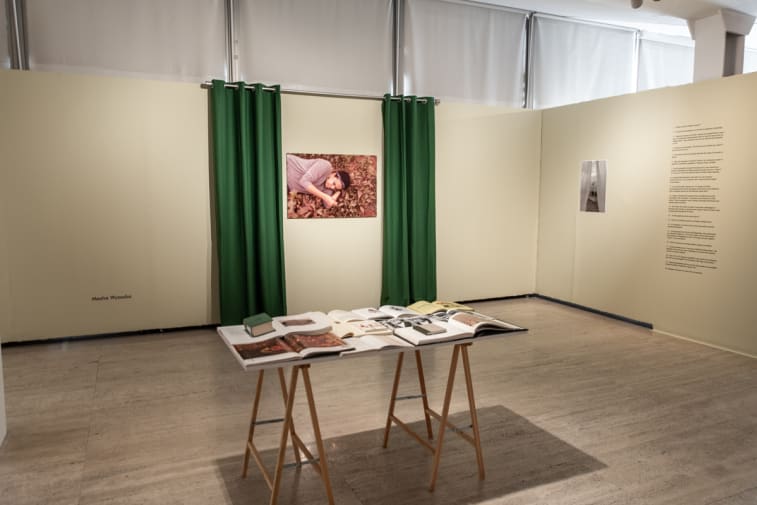 Photo of a table with artwork displayed