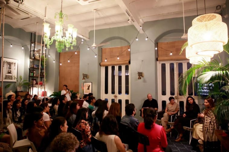 People listening to a panel discussion