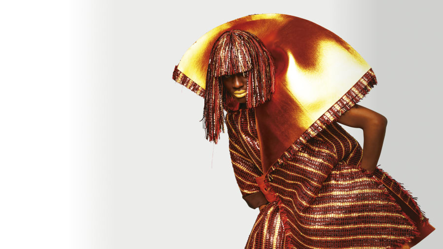 Model wearing red and gold